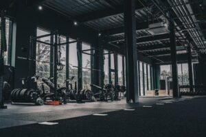 Large gym floor with rows of machines