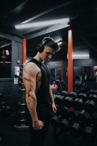 Person building arm strength in a gym